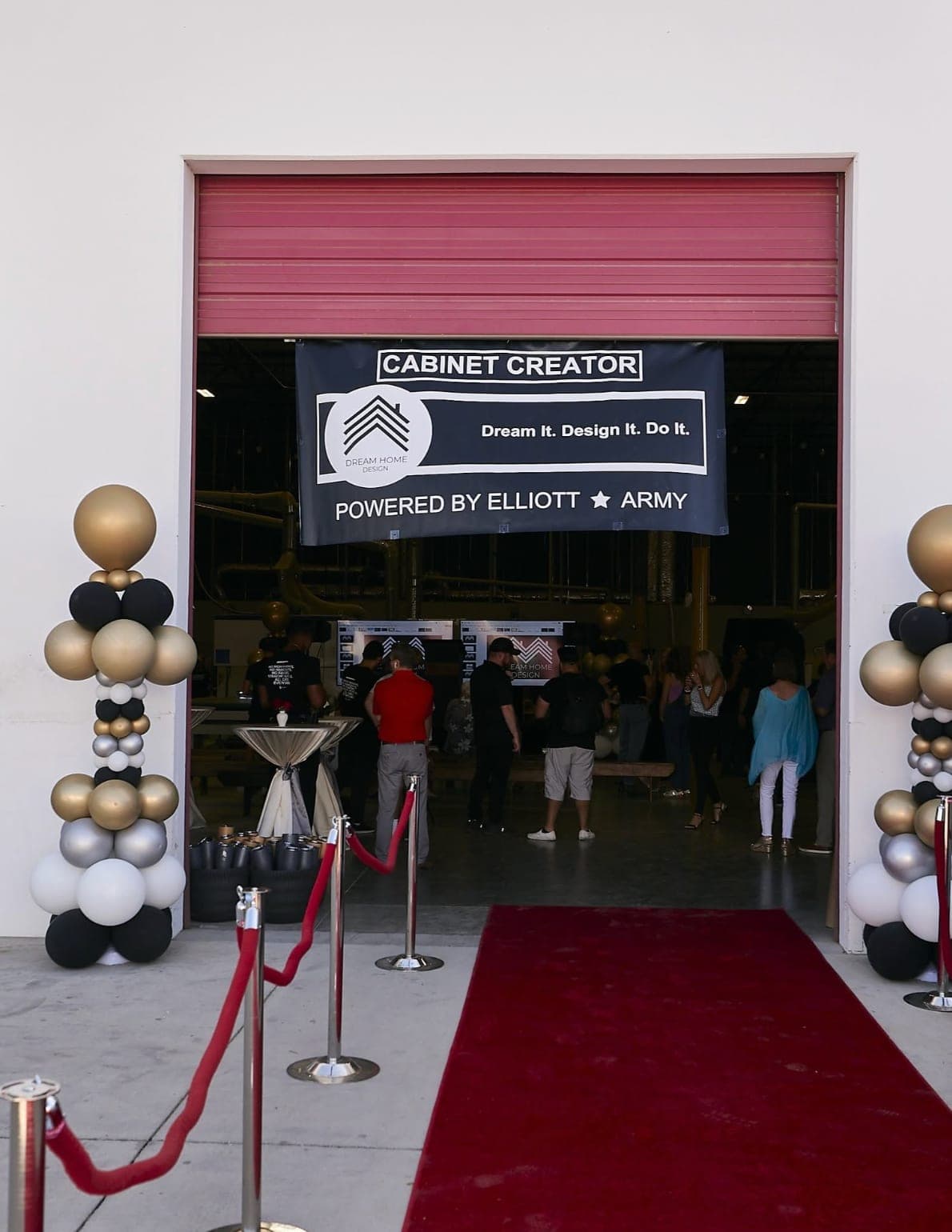 Red-carpet entrance with balloon columns and event branding at a corporate launch